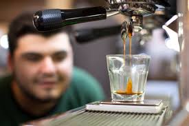 Expert barista preparing espresso